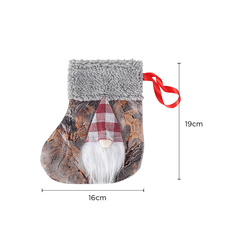 Decorative stocking with gnome design and measurements on a white background