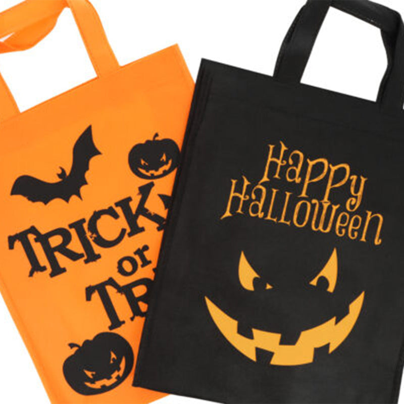 Two Halloween-themed tote bags, one orange with black text and graphics, the other black with a pumpkin face design.